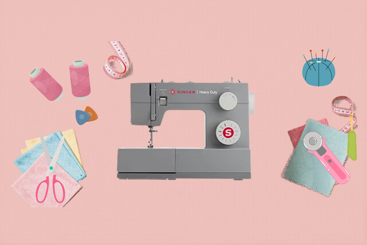 Beginner sewing kit essentials — sewing machine, fabric scissors, thread and tools laid out on a table